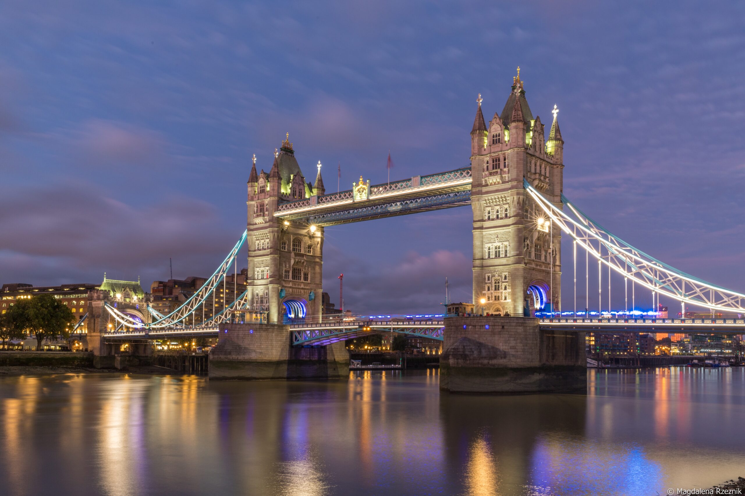 A low angle shot of the famous historic Tower Bridge in London during evening time
